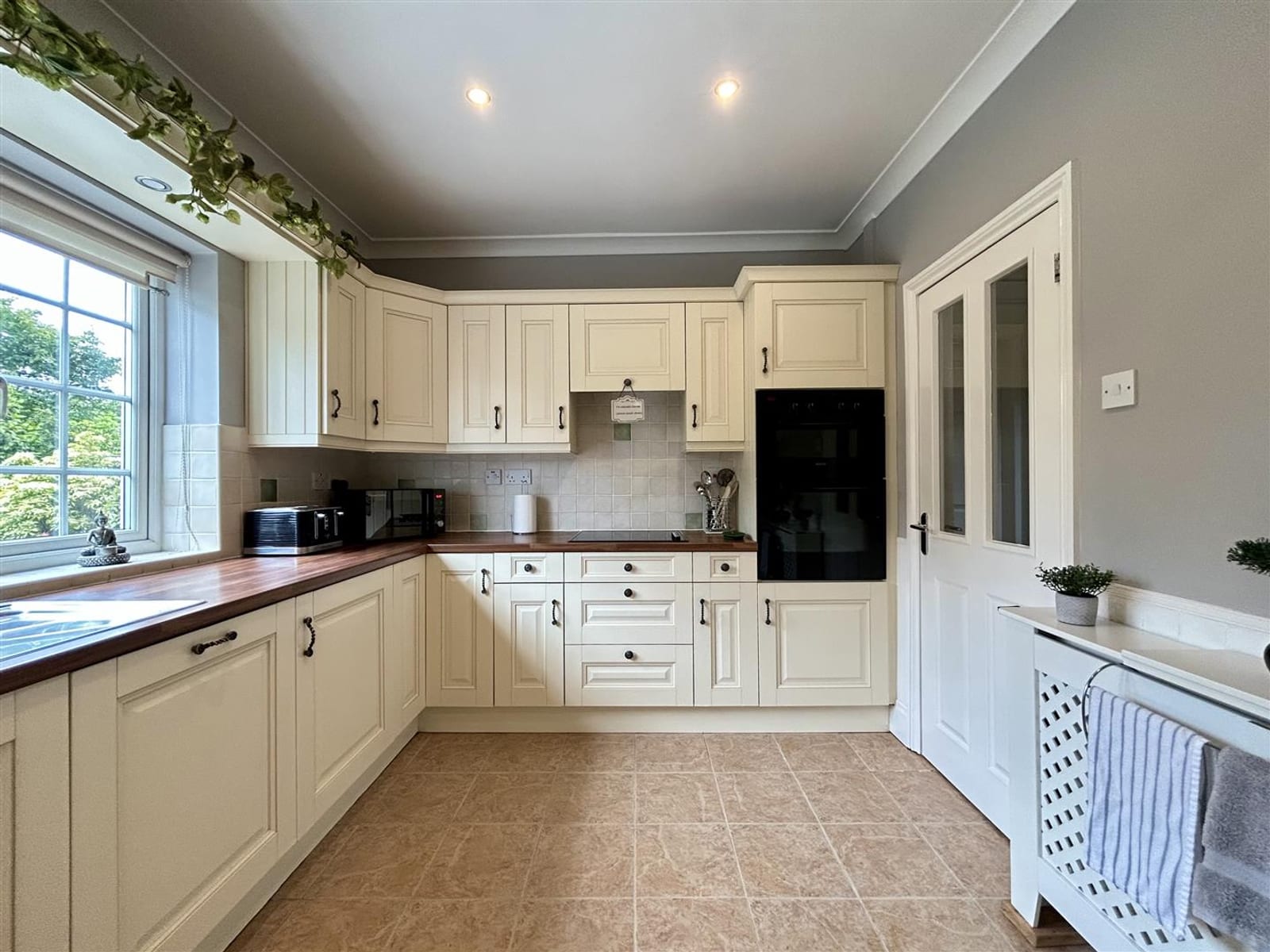 A dated cream kitchen before its Matchen makeover
